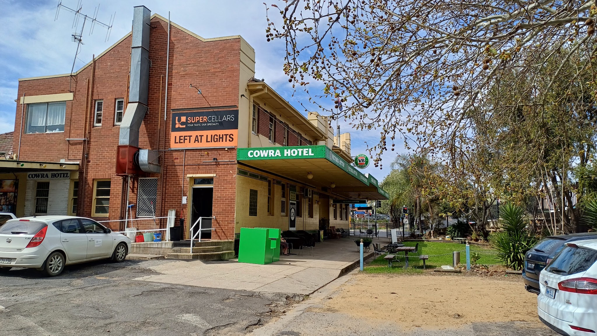 The Cowra Hotel on Kendal St with its green COWRA HOTEL awning and beer garden lawn